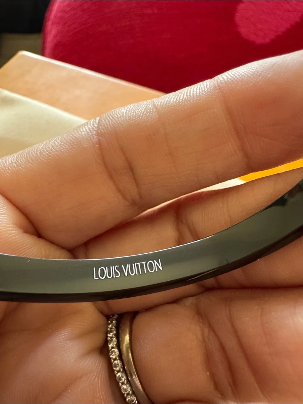 Louis Vuitton Black Bangle with Gold LV Motif